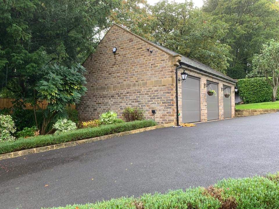 Stone-built detached garage beside a new driveway, Apperley Grange, Rawdon
