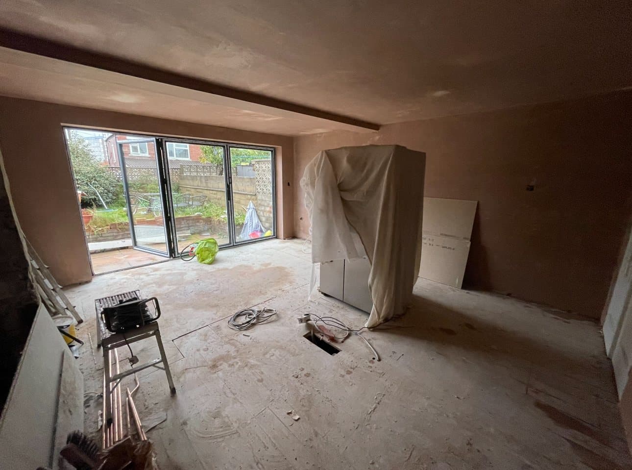 The extension plastered and ready for the kitchen, with bifold doors to the garden