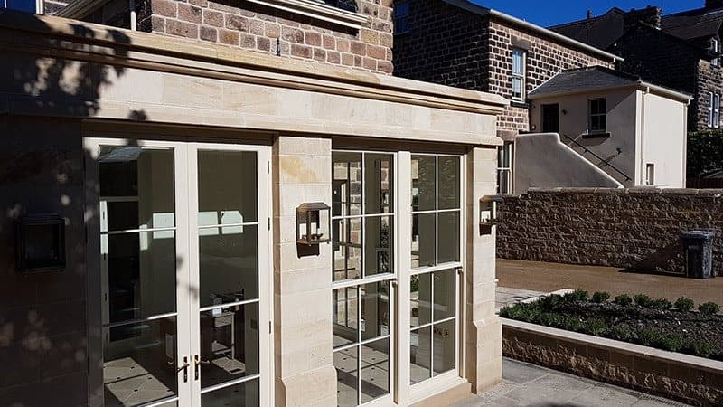 Stone orangery with glazed French doors and wall lanterns, Park Avenue, Harrogate