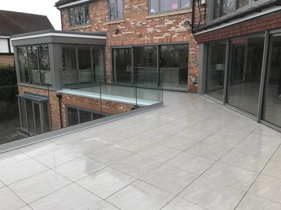 Balcony terrace with a glass balustrade and sliding doors, Stone Rings, Harrogate